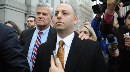 Dean and Adam Skelos leave federal court in