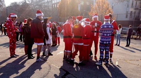 SantaCon participants gather in McCarren Park in Brooklyn
