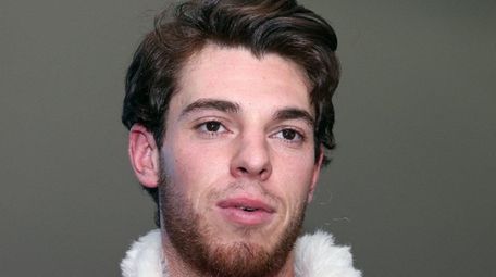 Mets pitcher Steven Matz, dressed as Santa Claus,