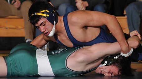 Jesse Bran-Umana of Massapequa, top, gets an advantage