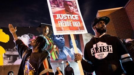 Protesters rally at the sight of last April's