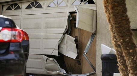 A garage door of Enrique Marquez's home