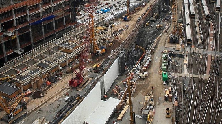 Ongoing construction of a rail tunnel, left, at