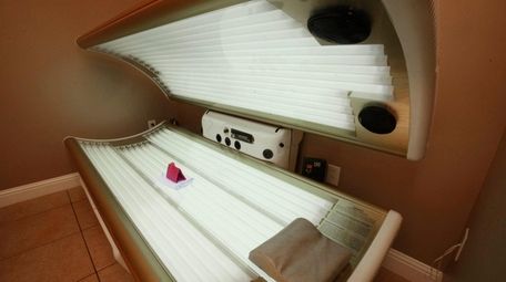 An open tanning bed is shown Dec.