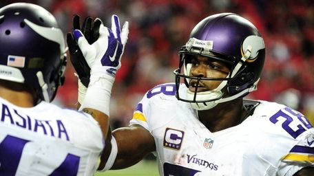 Adrian Peterson of the Minnesota Vikings celebrates a
