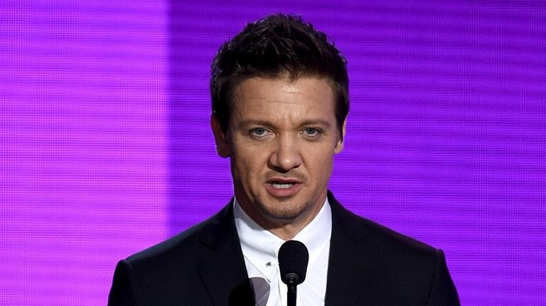 Actor Jeremy Renner presents an award during the