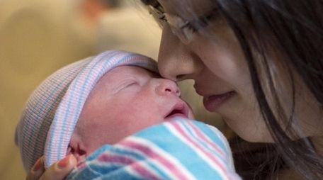 Daniella Malakov of Forest Hills with her newborn