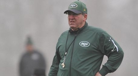 Bobby April watches team practice at the