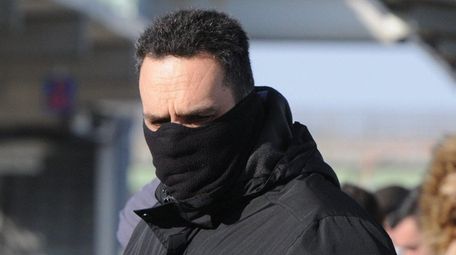 Chris Reina, of Stony Brook, bundled up at