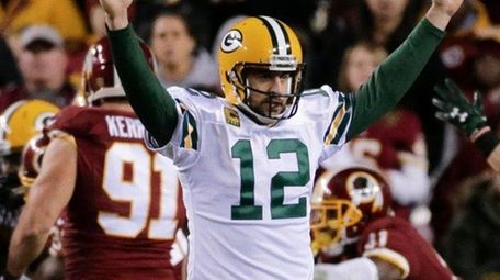 Green Bay Packers quarterback Aaron Rodgers celebrates