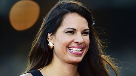 ESPN sideline reporter Jessica Mendoza looks on