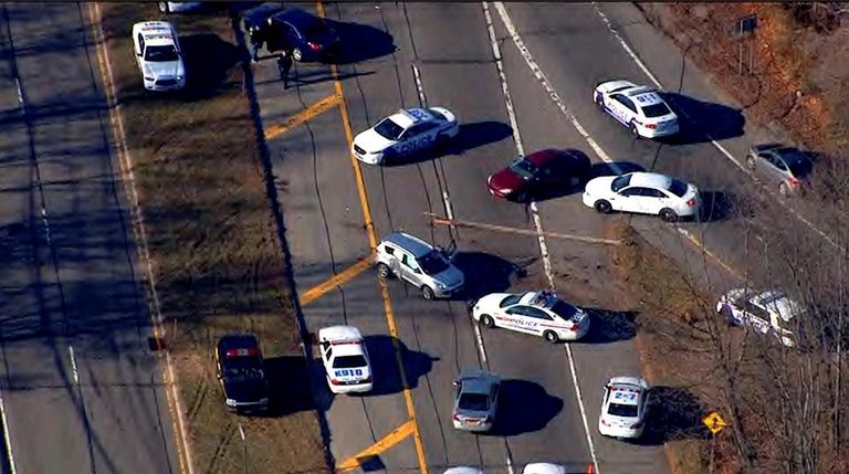 A silver car, center, is left behind on