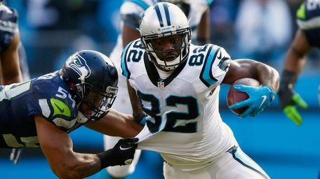 Jerricho Cotchery of the Carolina Panthers runs with
