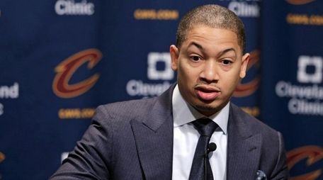 Cleveland Cavaliers coach Tyronn Lue answers questions during