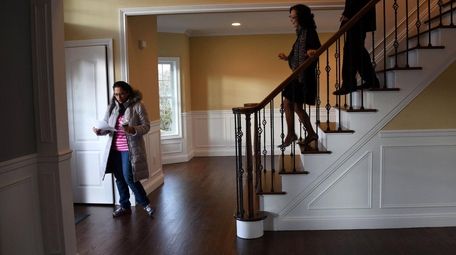 Prospective home buyer Sarah Jafri of Hicksville, left,