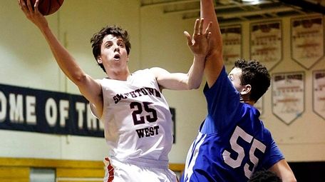 Smithtown West's Kyle LaGuardia scores a layup around