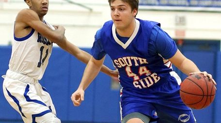 Alex Sorensen drives against Keandre Augustine in Roslyn