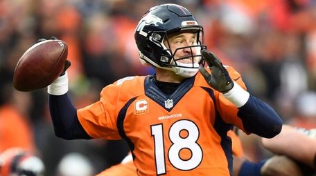 Denver Broncos quarterback Peyton Manning passes the