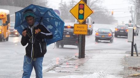 Ky'Reese Andrews, 19, of Ronkonkoma, walks around a