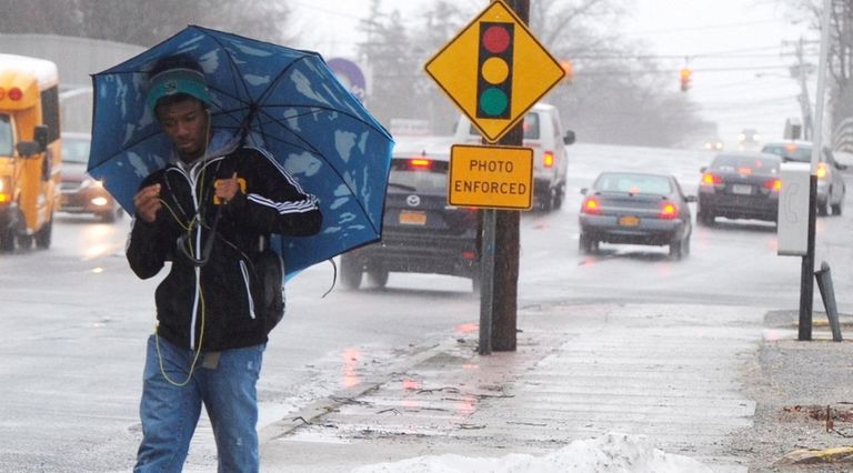 Ky'Reese Andrews, 19, of Ronkonkoma, walks around a