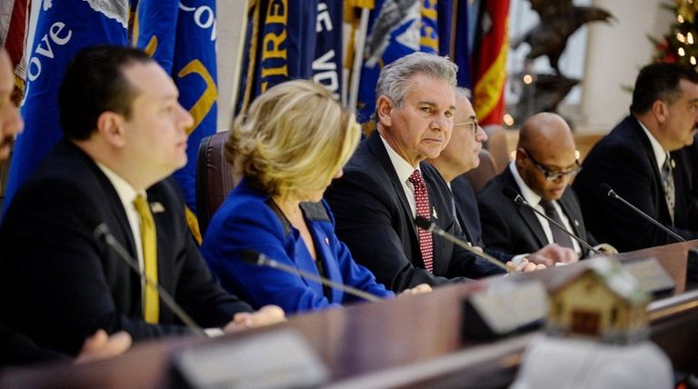 Mayor Reginald A. Spinello, center, sits with members