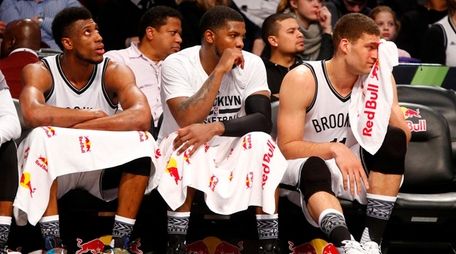 From left, Nets' Thaddeus Young, Joe Johnson and