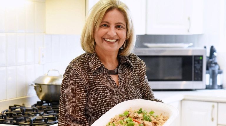 Nora Salimi of Westbury presents a platter of