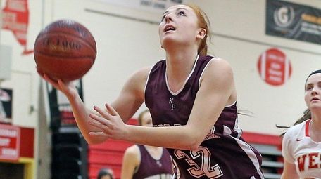 Kings Park's Tiffany Slicklein shoots under the basket