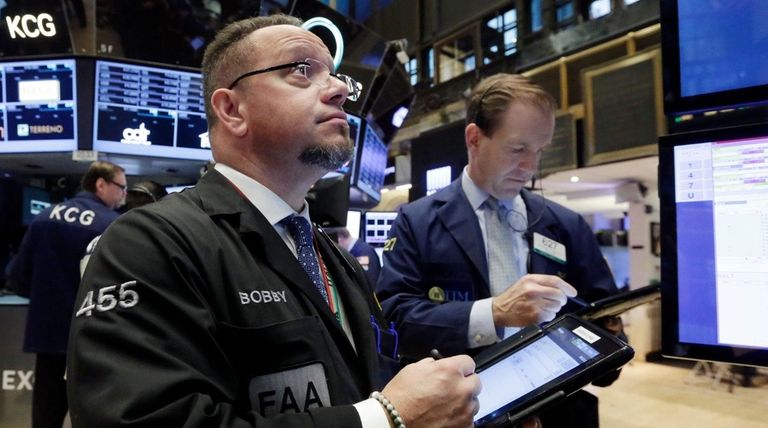 Traders Robert Arciero, left, and Michael Smyth watched