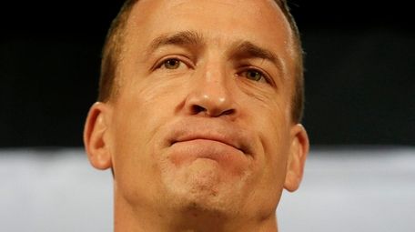 Denver Broncos quarterback Peyton Manning speaks to