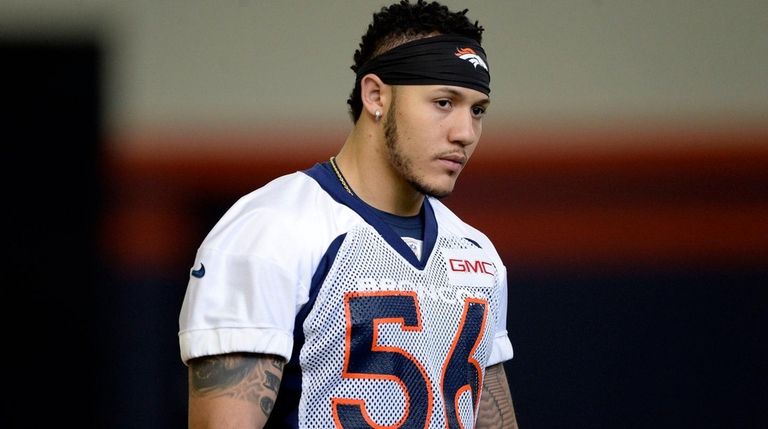 Denver Broncos' Shane Ray looks on in drills