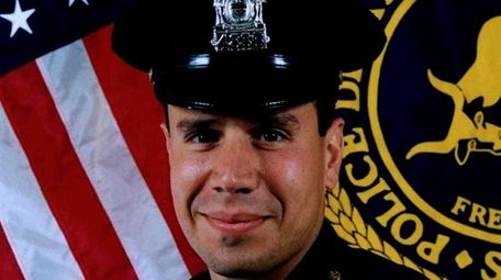 John Oliva, then a Suffolk police detective, is