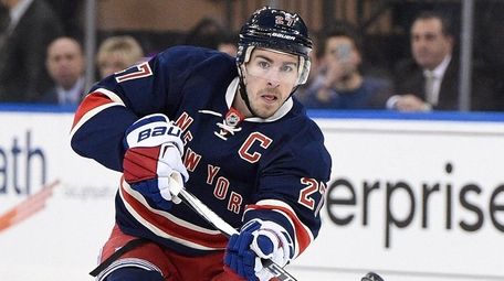 New York Rangers defenseman Ryan McDonagh passes the