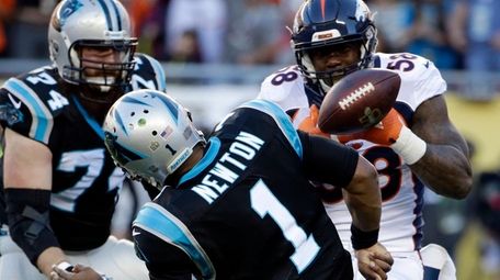 Denver Broncos linebacker Von Miller strips the ball