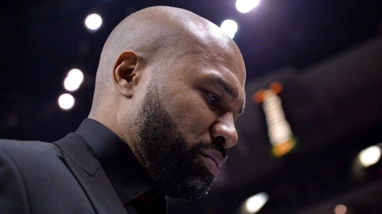 New York Knicks head coach Derek Fisher walks