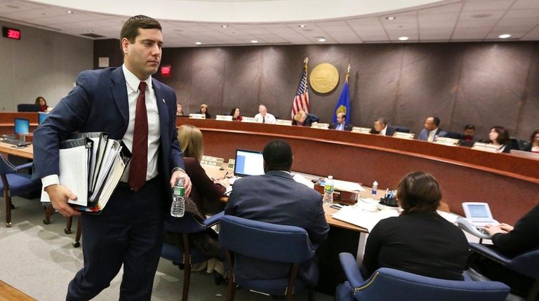 Acting Suffolk County Police Commissioner Timothy Sini leaves