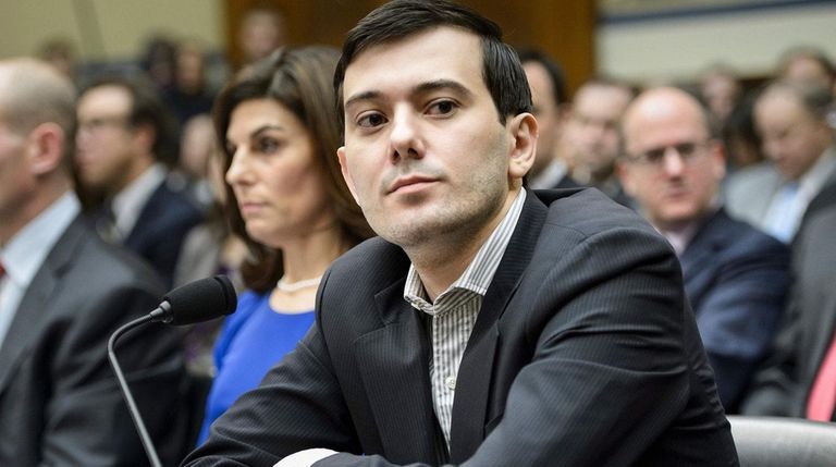 Former pharmaceutical executive Martin Shkreli listens during a