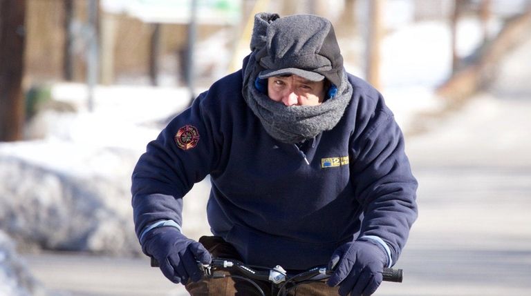 Lewis Gonzalez rides his bicycle in Blue Point