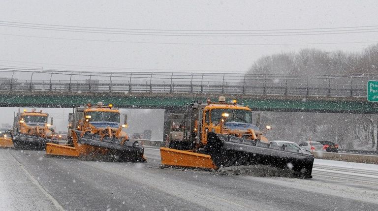 A line of snowplows on the eastbound LIE