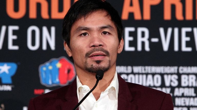 Boxer Manny Pacquiao speaks during a press