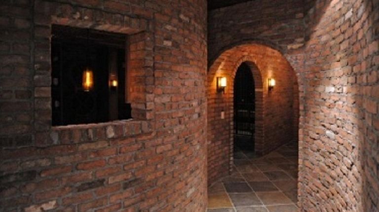The subterranean space has a stone floor and