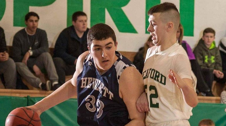 Hewlett's Zach Bromfeld drives against Seaford's Pat Quigley