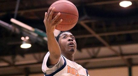 Nassau Community College's Marc Campbell soars for a