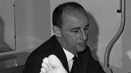 Harry Hulmes, the Baltimore Colts' publicity director, pays