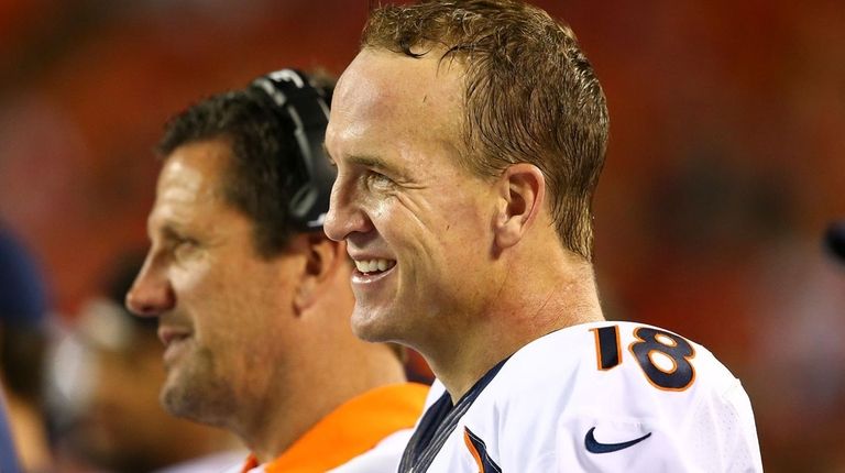 Peyton Manning of the Denver Broncos smiles after