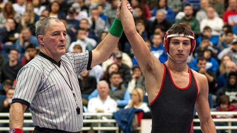 Syosset's Vito Arujau is declared the winner at