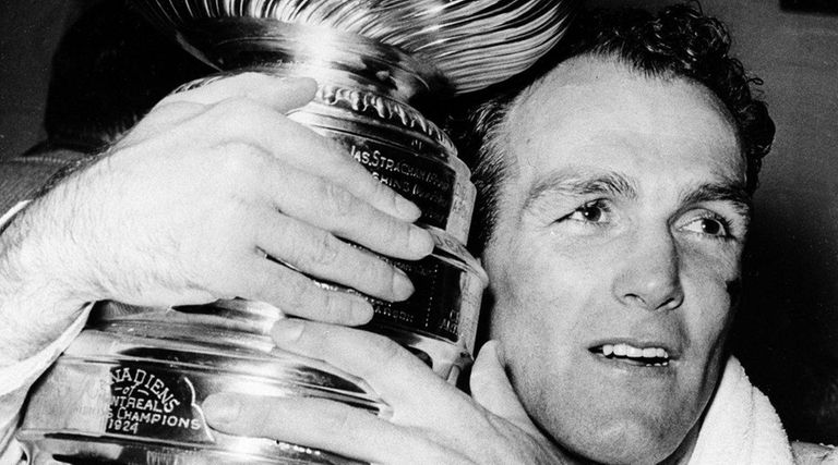 Montreal Canadiens forward Henri Richard hugs the