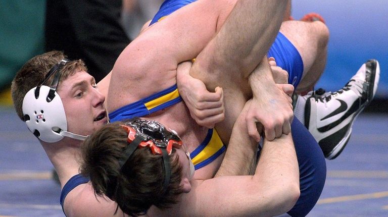 Christian Araneo, left, controls Baldwinsville's Alex Bowen III