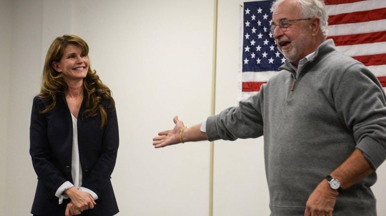 Anna Throne-Holst listens as former Rep. Tim Bishop
