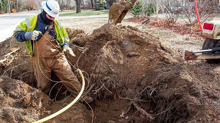 A National Grid worker puts in a gas